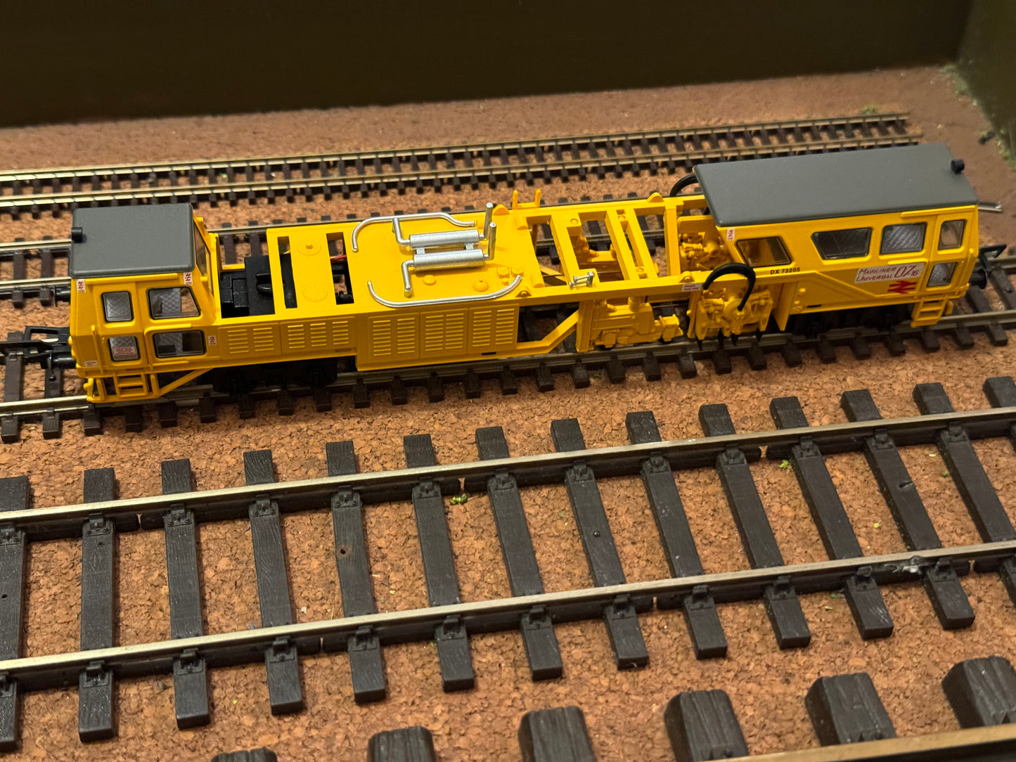 Bachmann (OO) British Rail, Plasser Tamper Machine (Motorised) No.DX73205 in BR Departmental Yellow and Bachmann (OO) British Rail, Plasser OWB 10 with Crane No.DX68200 in Departmental Yellow